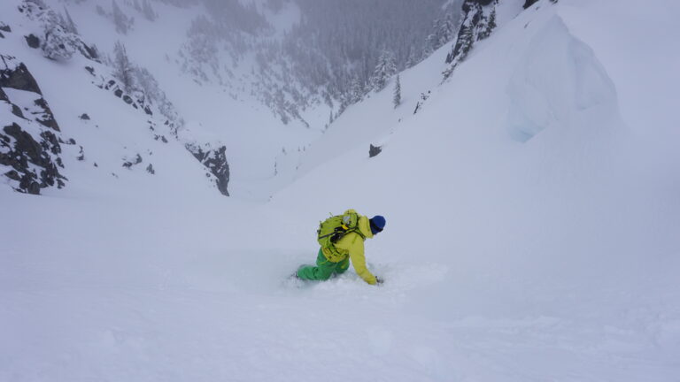 Dropping in to the secnd run of our day snowboarding Tamanos Mountain in Mount Rainier National Park